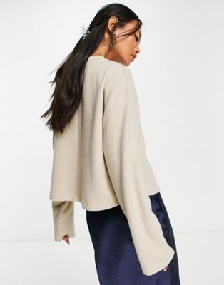 ASOS DESIGN super soft oversized sweater with pocket detail in warm cream
