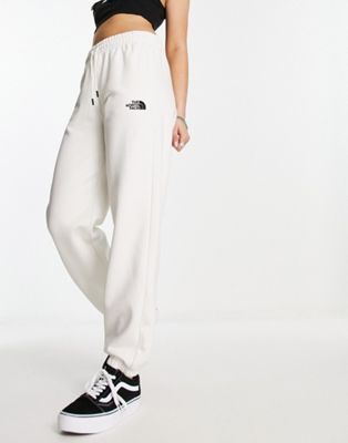The North Face Essential oversized sweatpants in cream Exclusive to ASOS