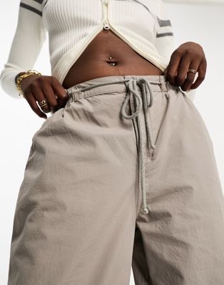 ASOS DESIGN Tall parachute cargo pants with tie waist in washed stone