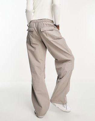 ASOS DESIGN Tall parachute cargo pants with tie waist in washed stone